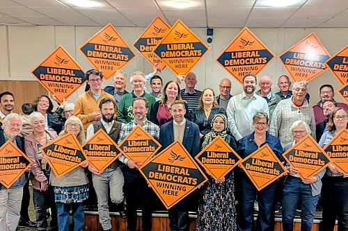 Haringey Lib Dems holding orange diamonds